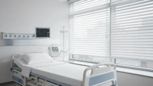 Commercial blinds installed in a hospital patient room for privacy and light control
